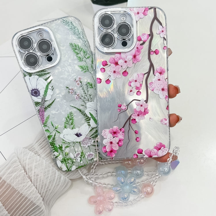 For iPhone 16e Electroplating Flowers Plants Texture Wristband TPU Phone Case(Sakura FL12) - iPhone 16e Cases by PMC TechLife | Online Shopping South Africa | PMC TechLife | Buy Now Pay Later Mobicred